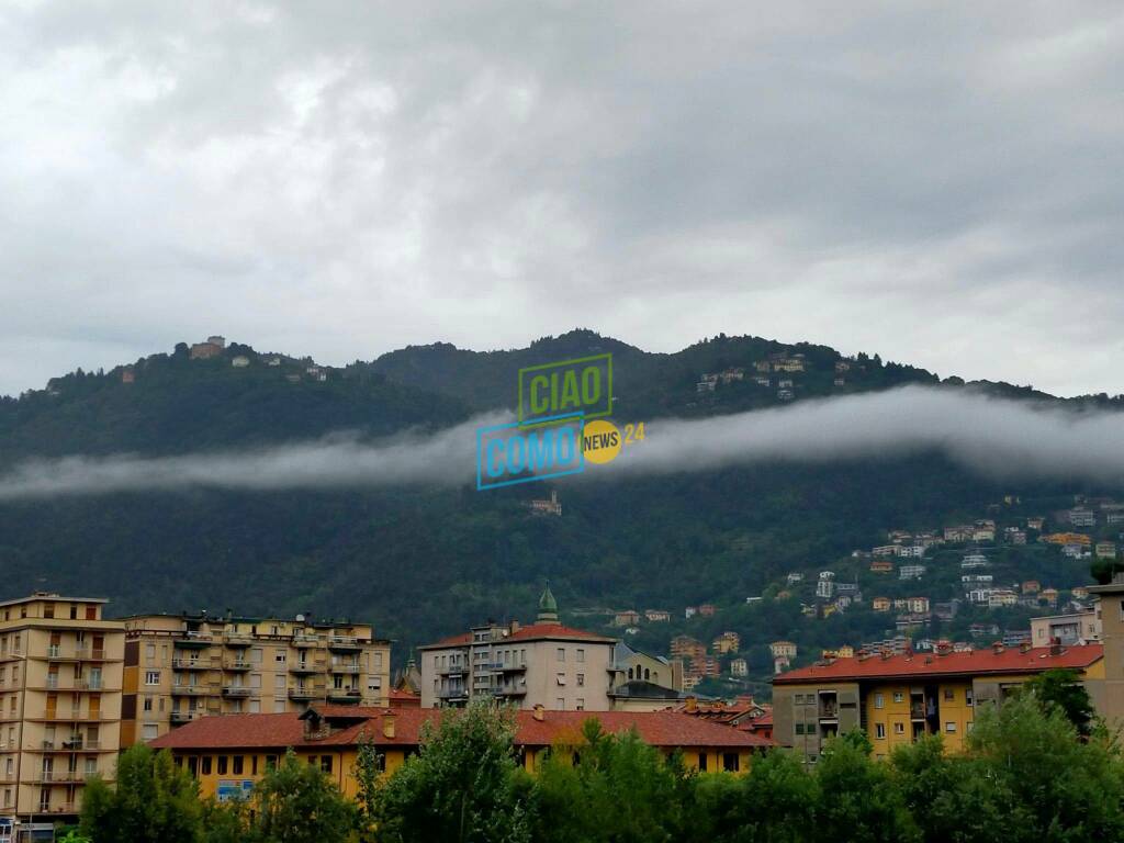 pioggia ed allagamenti in provincia dopo caldo di ieri foto allagamenti e nuvoler sopra brunate